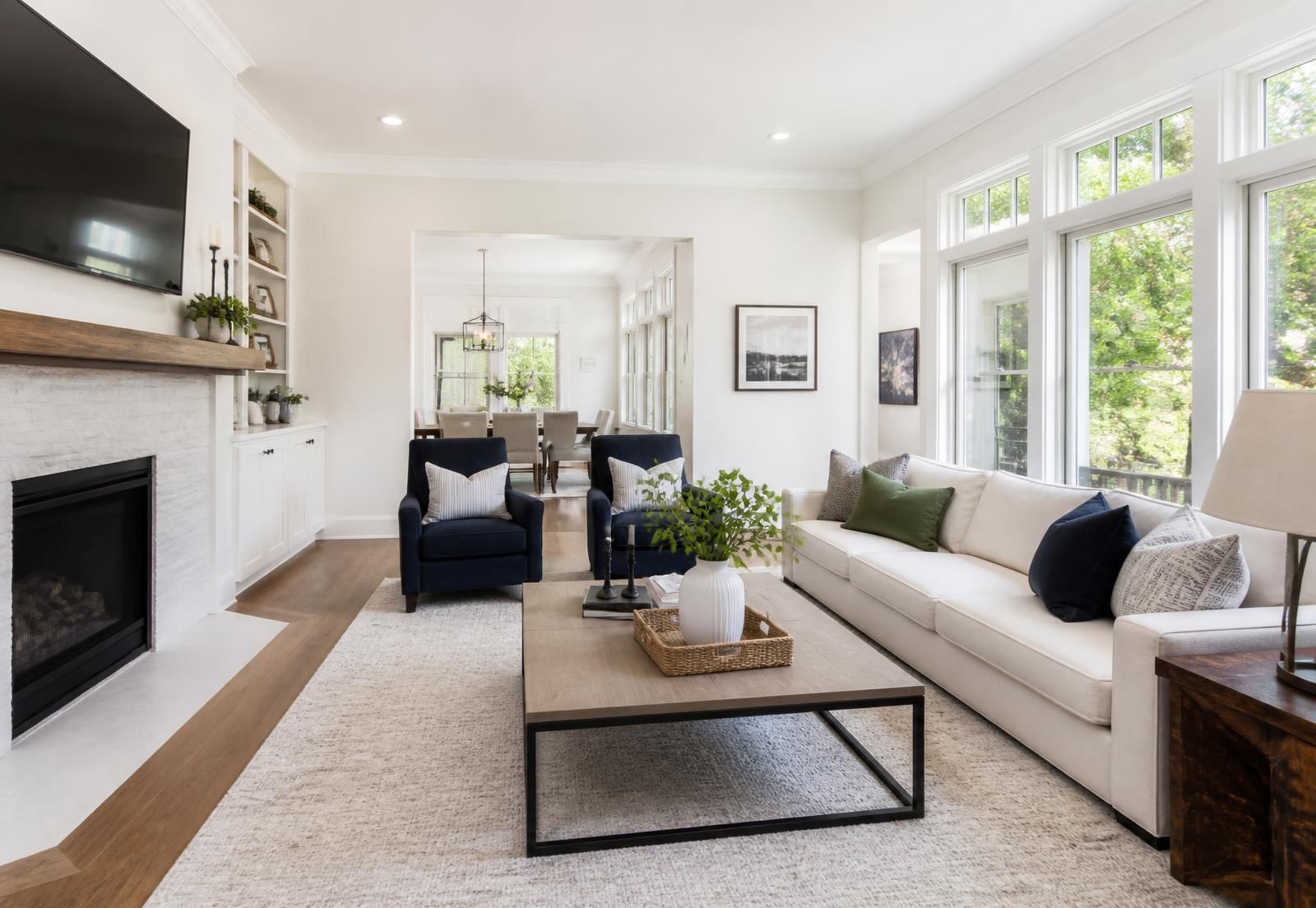 Bright, freshly cleaned living room with natural light and tidy furnishings